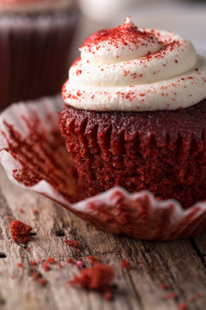 istock Red Velvet Cupcake on Rustic Wood Table 864811848