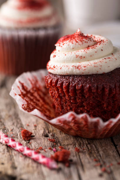 istock Red Velvet Cupcake on Rustic Wood Table with Birthday Candle 864812020