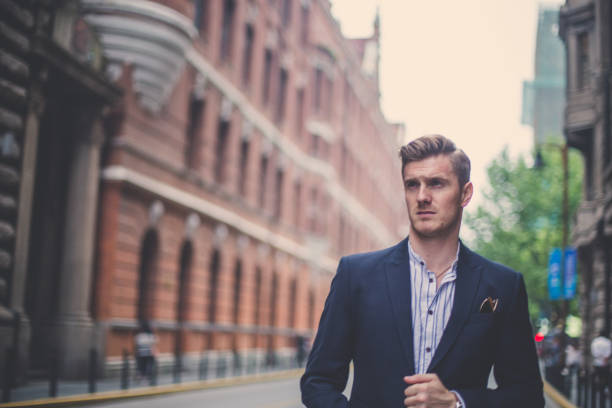 istock Attractive businessman standing outdoors 864820604
