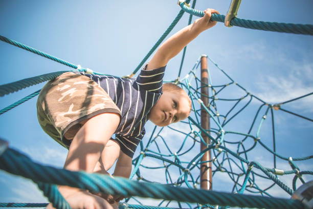 istock Climbing at the local park 864824484