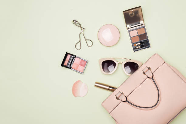 istock Makeup products with cosmetic bag on color background 864828316