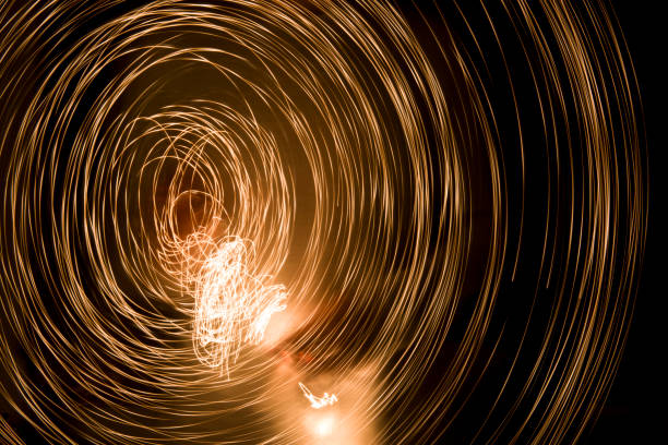istock Abstract Image Of Yellow Light Trails At NightAbstract lines on black. 864834784