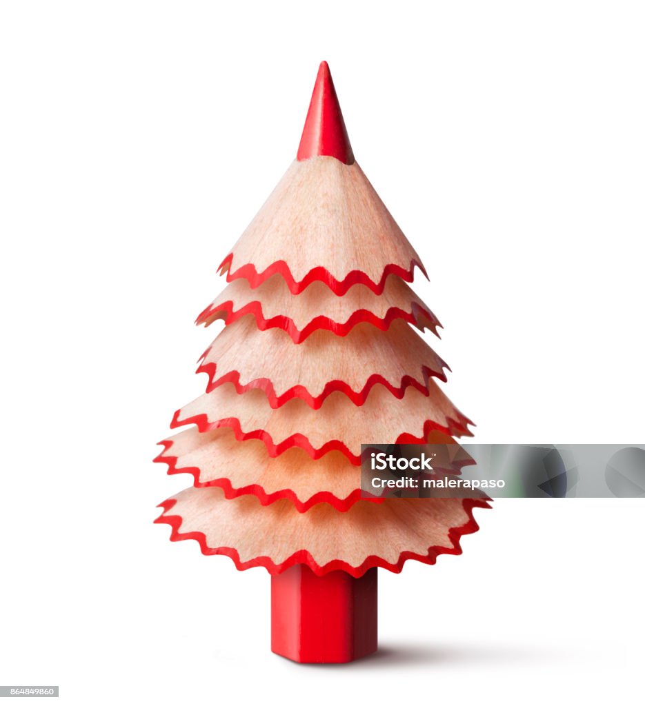 Christmas tree made with a pencil and its wooden shavings. Red pencil shaving Christmas tree on a white background. Christmas Stock Photo