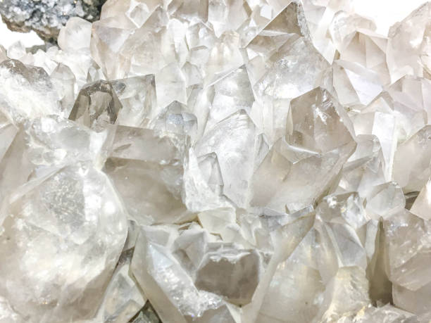 White Quartz Crystal cluster on black background.