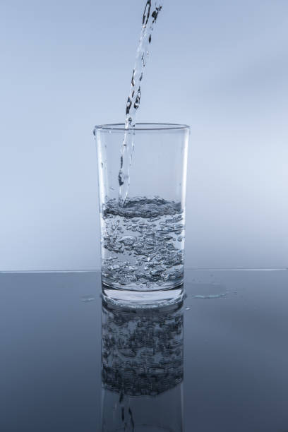 istock Pour drinking water into the glass. 864857054