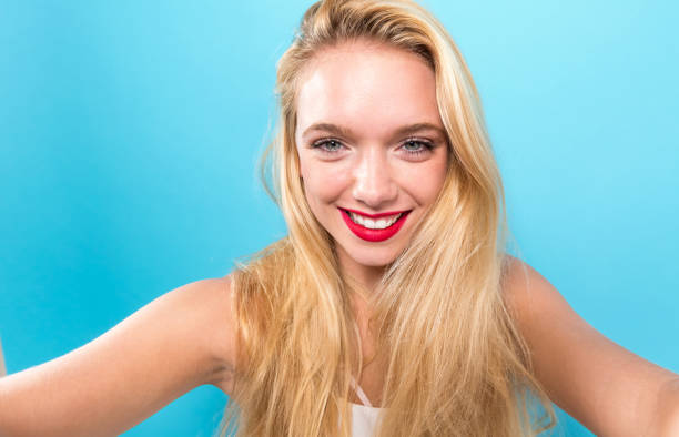 istock Young woman taking a selfie 864865672