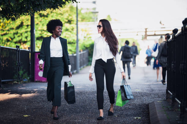 istock Two businesswoman walking down a pedestrian road after work. 864885042