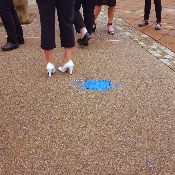 istock Group of people on pavement. 864899604