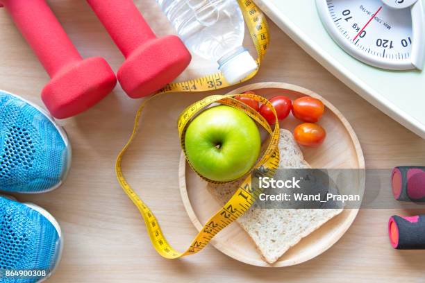 Green Apple And Weight Scalemeasure Tap With Clean Water And Sport Equipment For Women Diet Slimming Diet And Healthy Concept Stock Photo - Download Image Now