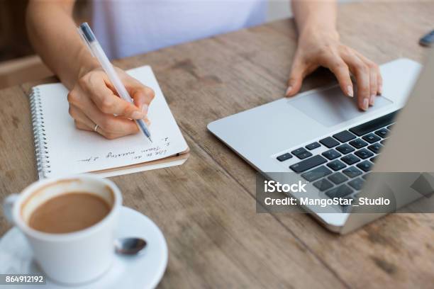Cropped View Of Woman Working On Laptop In Cafe Stock Photo - Download Image Now - List, Making, Planning
