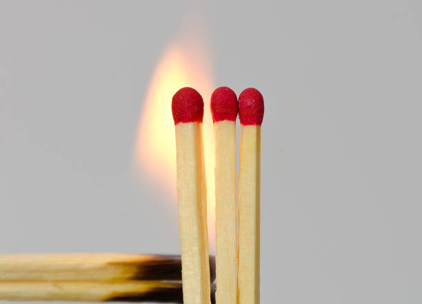 istock upright staying matches with red heads 864912234