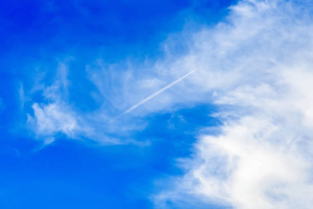 istock White textured clouds in the blue sky. 864912390