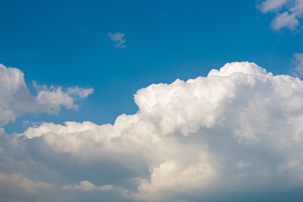 istock Sunny weather with cumulus clouds on blue sky 864914914