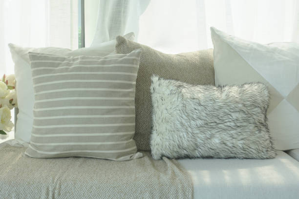 istock Brown color scheme pillows setting on sofa in living room 864921406