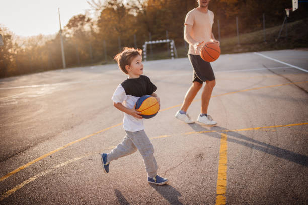 istock On basketball court with my dad 864925866