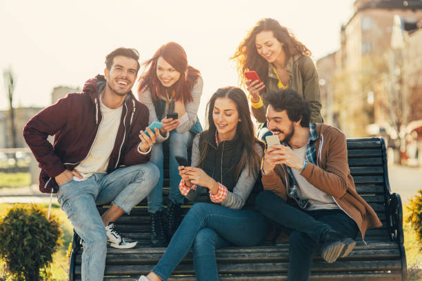 istock Friends texting in the city 864925908