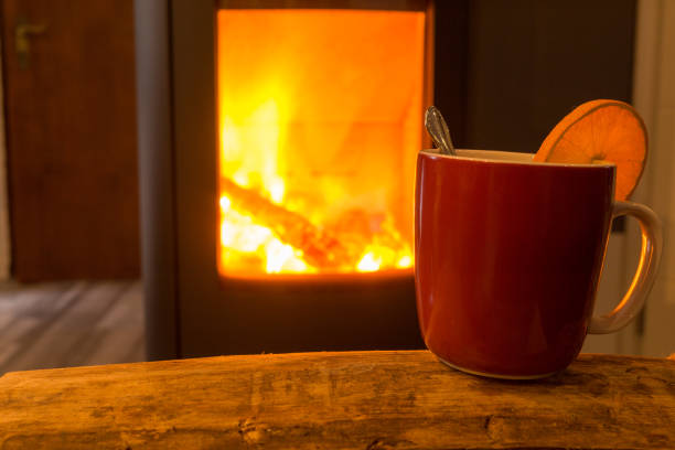 istock one red mug lonely on wood and fireplace 864925996