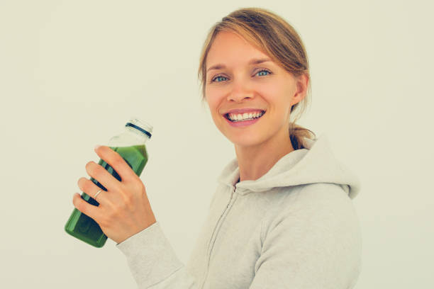 istock Optimistic sporty woman maintaining balanced diet 864926582
