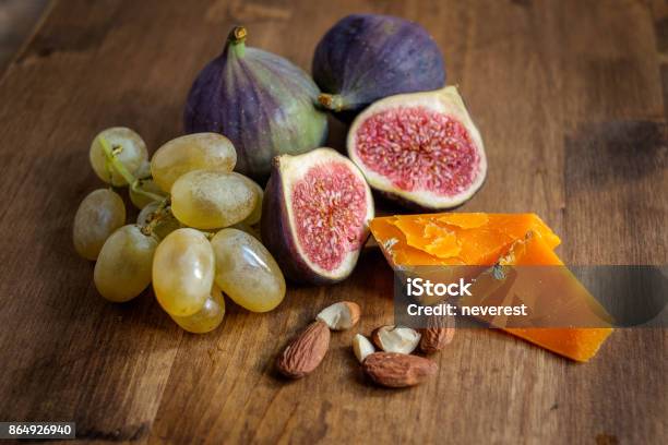 Figs On A Table Stock Photo - Download Image Now - Mimolette, Almond, Autumn
