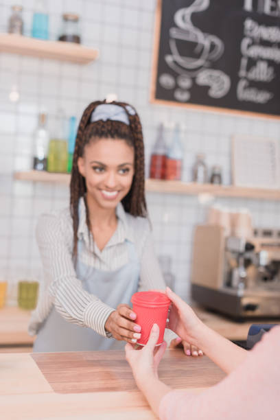 istock barista handing customer coffee 864926984