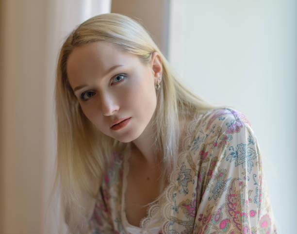 istock The girl at the window. 864932596