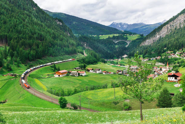 istock train on a background of village 864932606