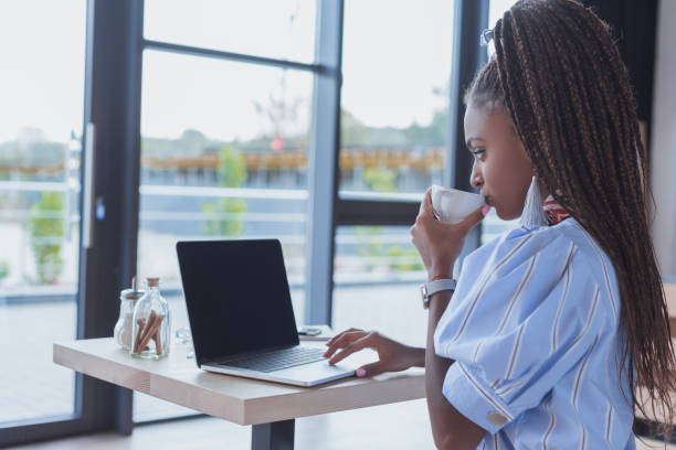 istock woman working with laptop at cafe 864932992