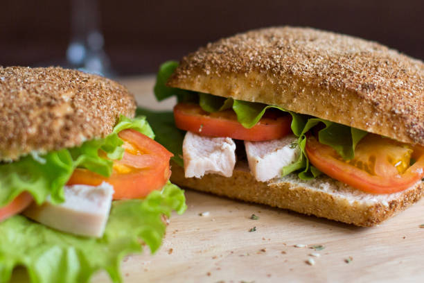 istock Two sandwich with chicken and tomatoes for breakfast. 864937222