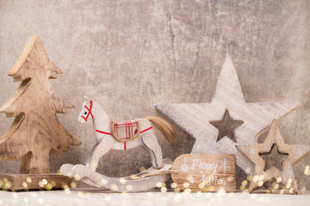 istock Christmas tree decorations on a wooden background. With bokeh ornaments. 864940516
