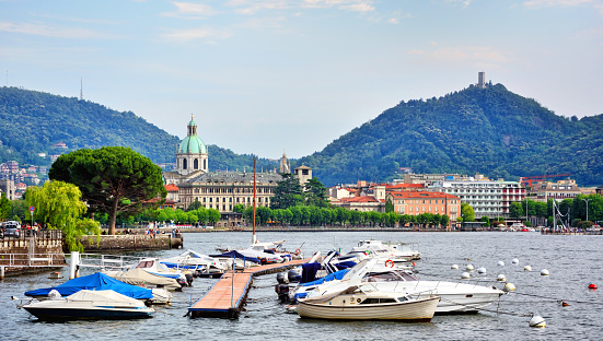 Boats in the marina of Como at sunset, Italy