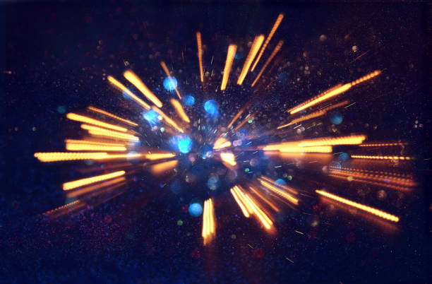 istock abstract bokeh background of golden light burst made from bokeh motion 864944316