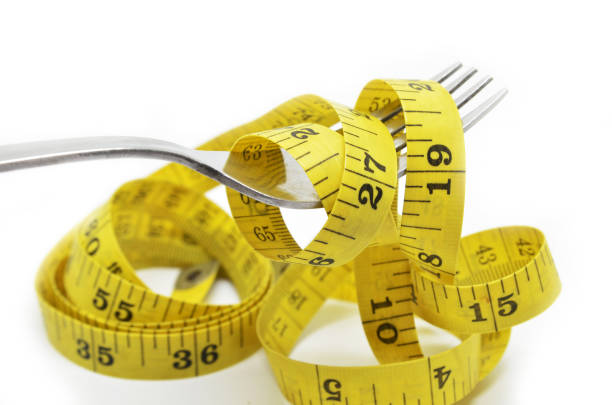 istock Steel fork and measuring tape 864946916