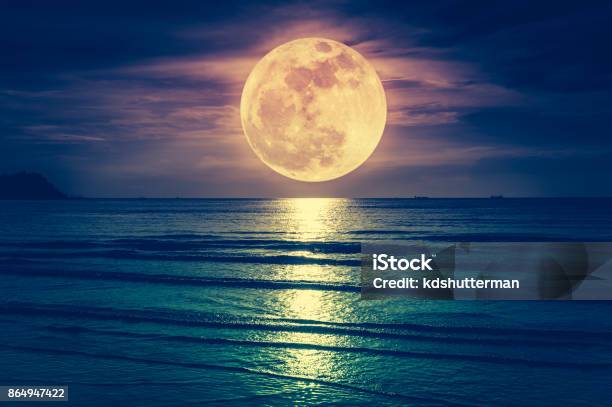 Super Moon Colorful Sky With Cloud And Bright Full Moon Over Seascape Stock Photo - Download Image Now