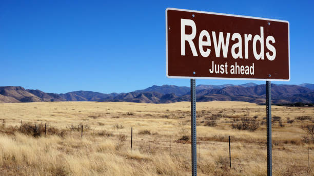 rewards brown road sign - accolade imagens e fotografias de stock