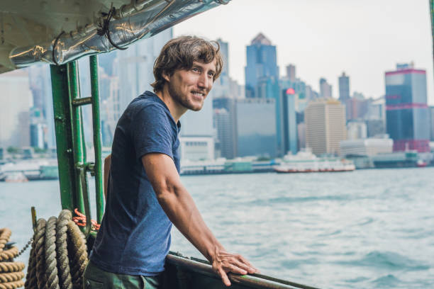 istock A young man on a ferry in Hong Kong 864954796