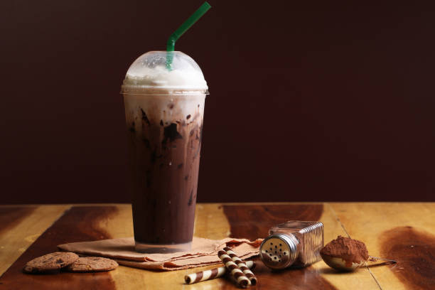 istock Ice cocoa soft drink on wood floor and topping 864955304