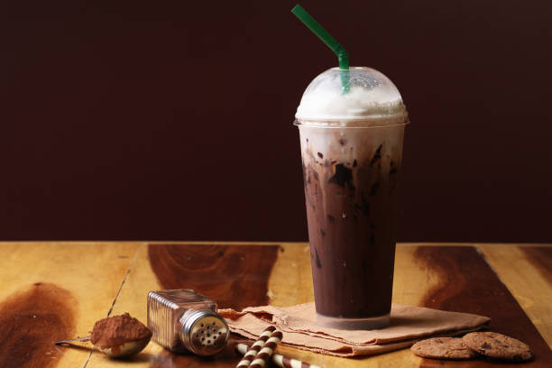 istock Ice cocoa soft drink on wood floor and topping 864955358