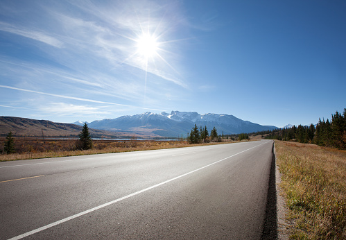 an empty stretch of the canadian highway through the rocky mountains in Jasper, Alberta