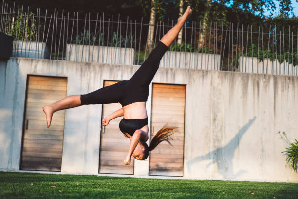 istock Amazing female dancer jumping 864959308