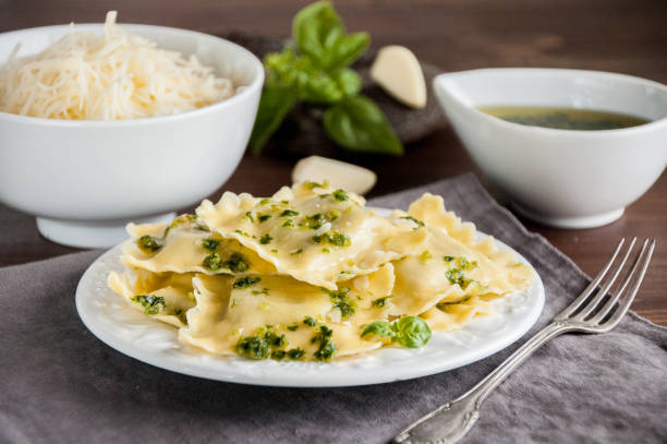 istock Plate of ravioli on wooden table 864964426