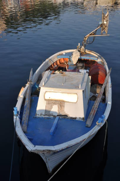istock Old fishing boat in harbor 864965378