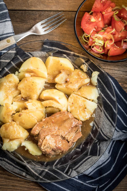 istock Stewed pork meat served with potatoes 864968598