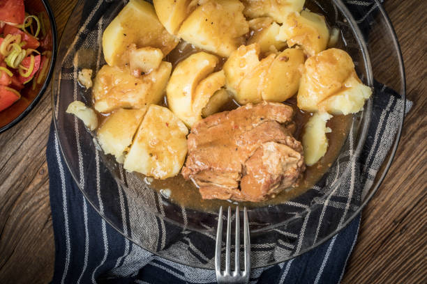 istock Stewed pork meat served with potatoes 864968672