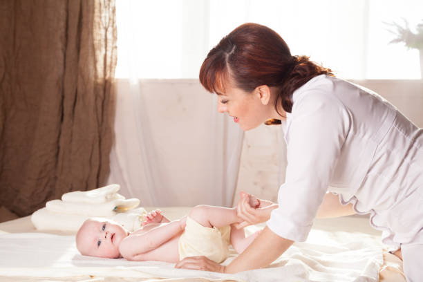 istock the little boy baby doctor doing massage 864969144