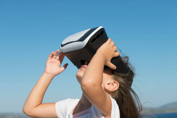 istock Girl playing virtual glasses 864970346