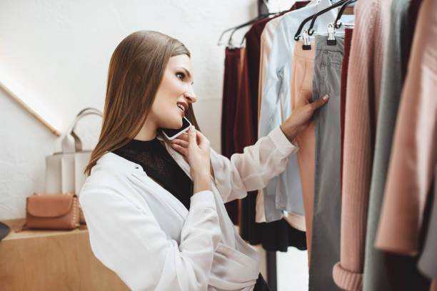 istock woman with smartphone choosing clothes 864980006