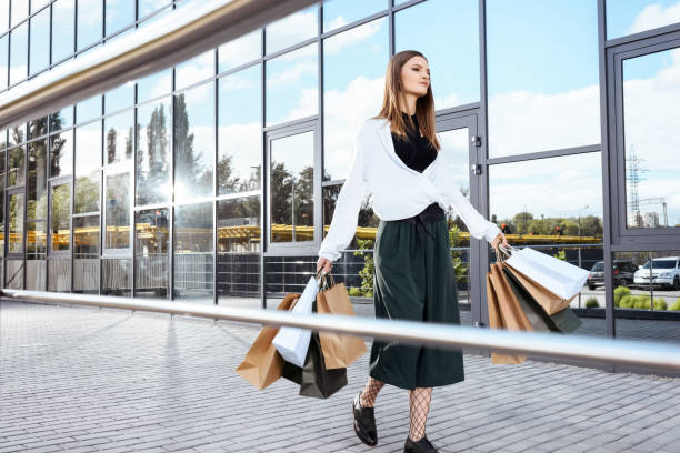 istock woman with shopping bags 864983780