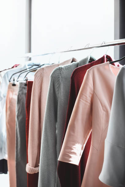 istock clothes hanging on hangers in boutique 864983934