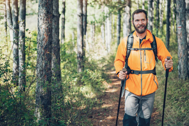 istock Smiling hiker walking in the mountain 864984758