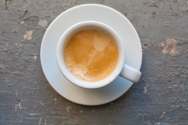 istock Cup of coffee esspresso, top view on grey grunge background 864990932
